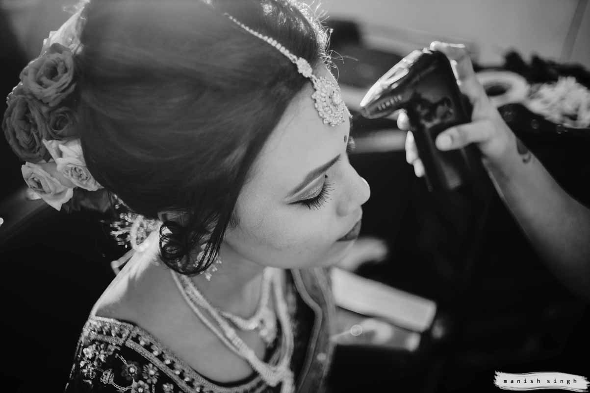 Bride face makeup being done in parlour