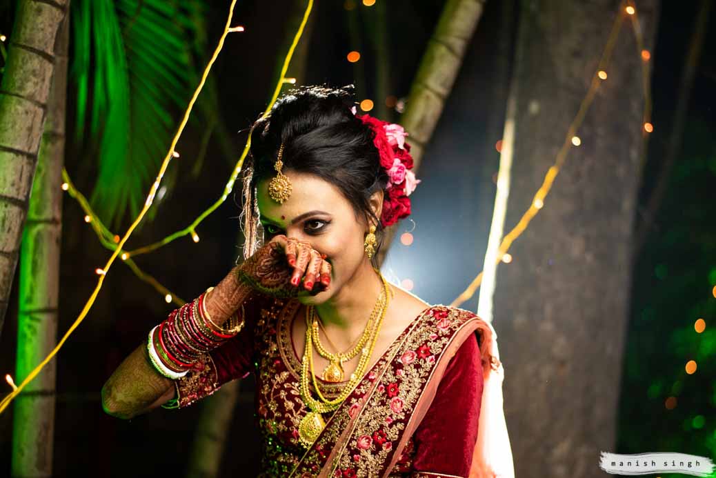 Candid smile of bride with hand over face