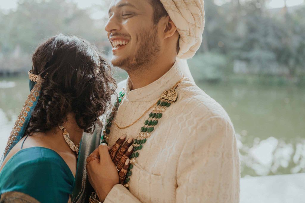 groom's awesome reaction while hugging bride