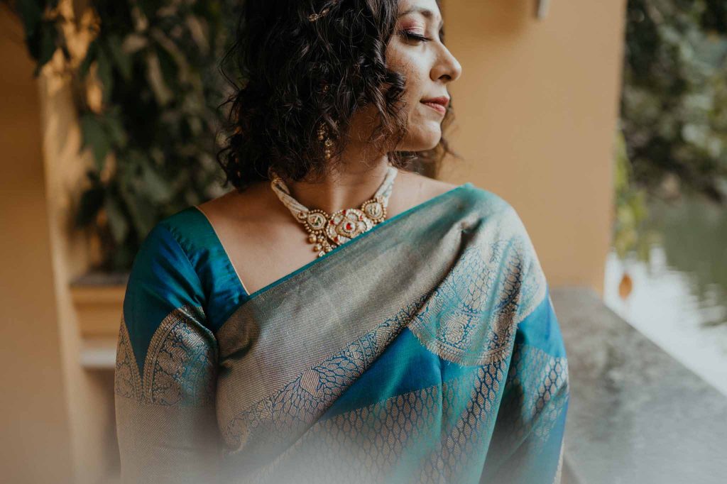 bride looking towards lake in Mayfair lagoon Bhubaneswar