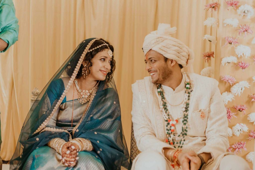 bride and groom talking to each other during wedding ceremony